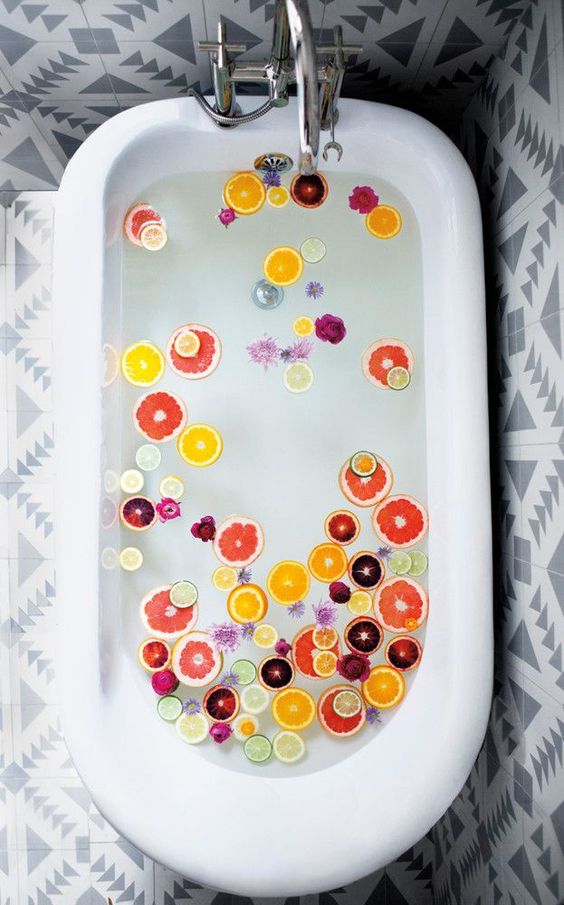 Add sliced citrus to your bath to create a refreshing soak.